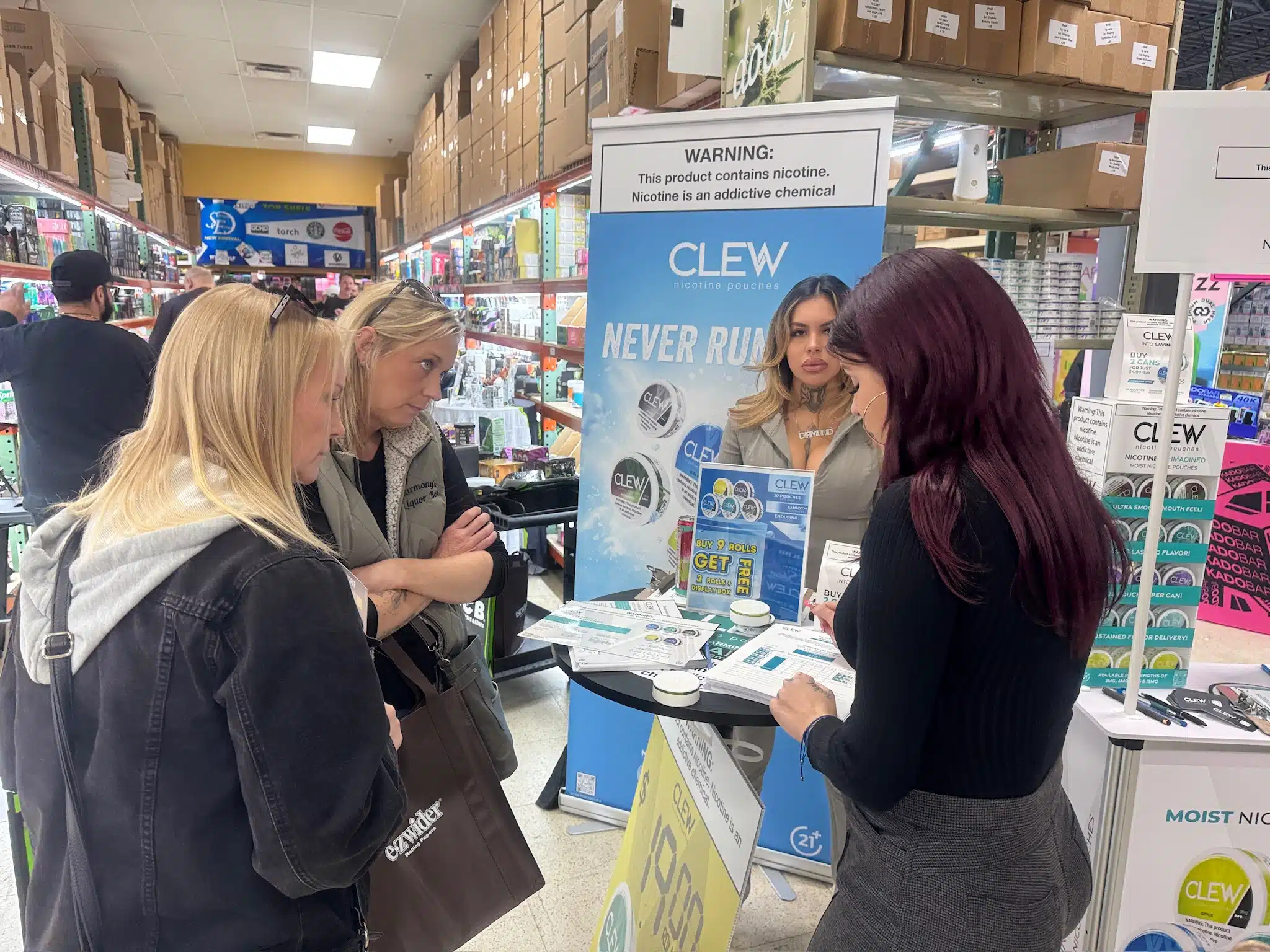 Attendees learning about products from a booth representative